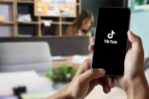 closed-up-image-female-using-tiktok-application-smartphone-office-9-oct-2022-chiangmai-thailand-3