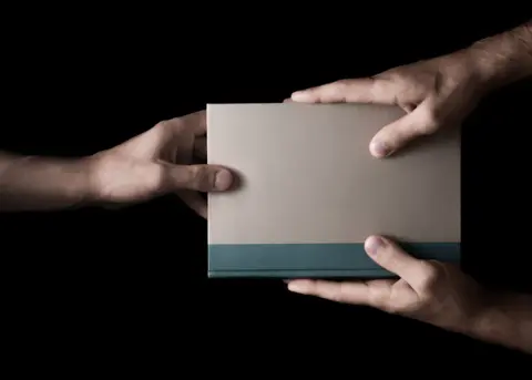 book-male-hands-black