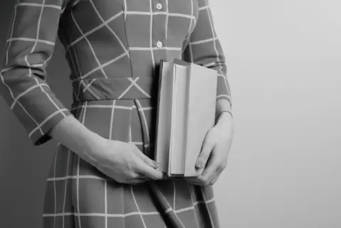 close-up-girl-with-two-books-1