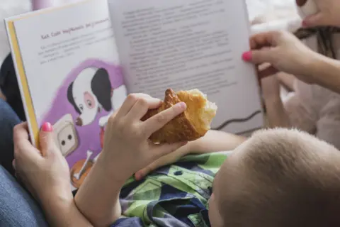 close-up-boy-with-sweet-book-background1
