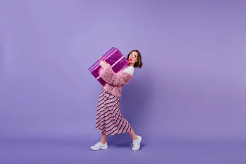 10-lovable-young-woman-white-sneakers-posing-with-present-box-fascinating-girl-making-kissing-face-expressing-while-holding-big-gift