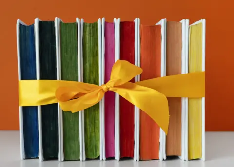 9-rainbow-books-stack-with-yellow-ribbon