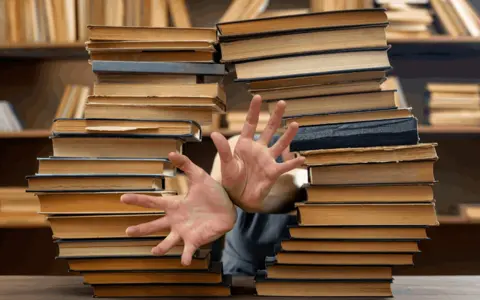 hands-through-old-library